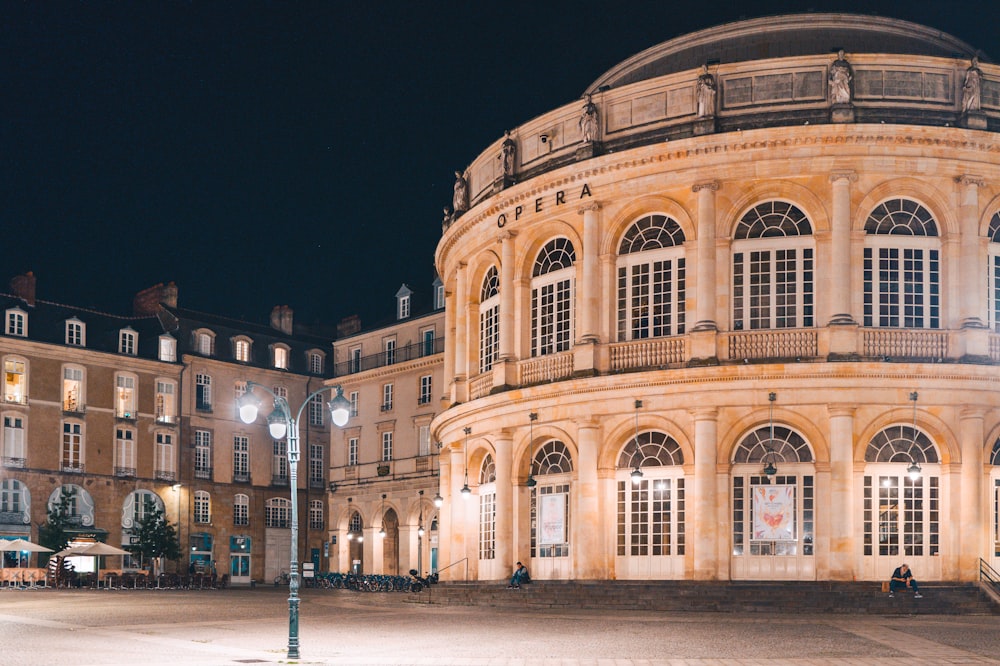 a large building with a lot of windows at night