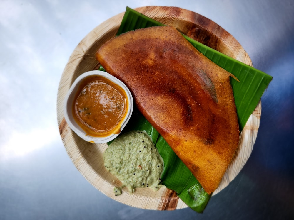 a plate of food on a wooden plate