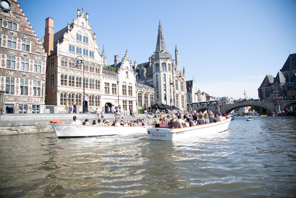 a group of people riding on top of a boat on a river