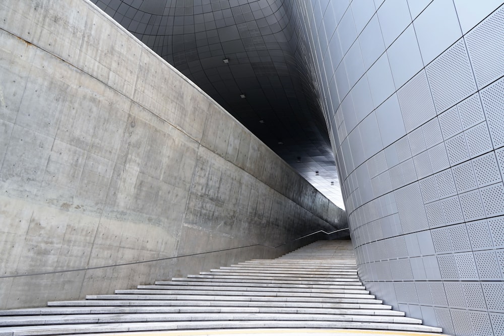 a very tall building with some stairs going up it