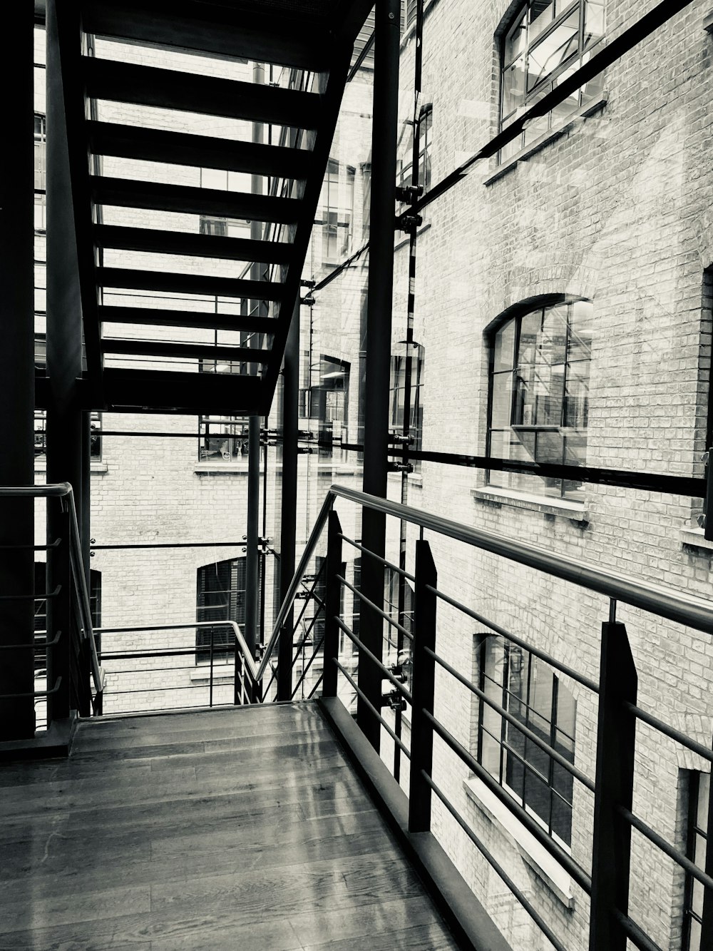 a black and white photo of a stairway in a building