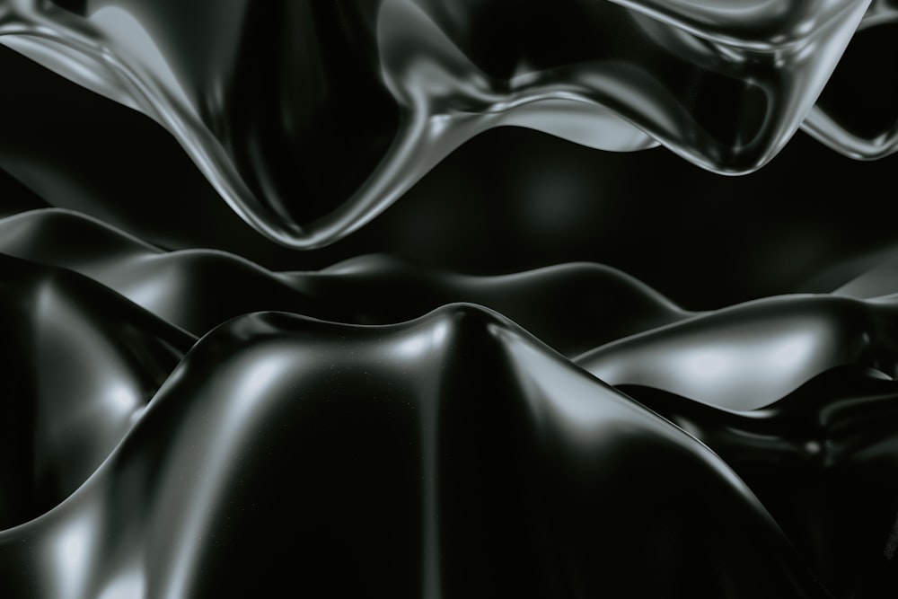 a black and white photo of a wavy surface