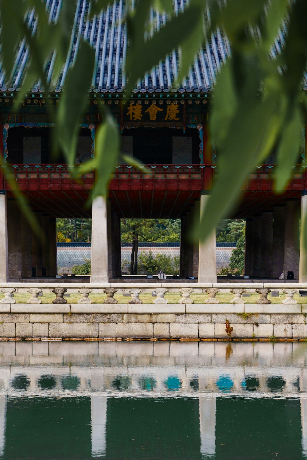 a view of a building from across a body of water