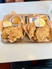 a couple of trays of food on a table