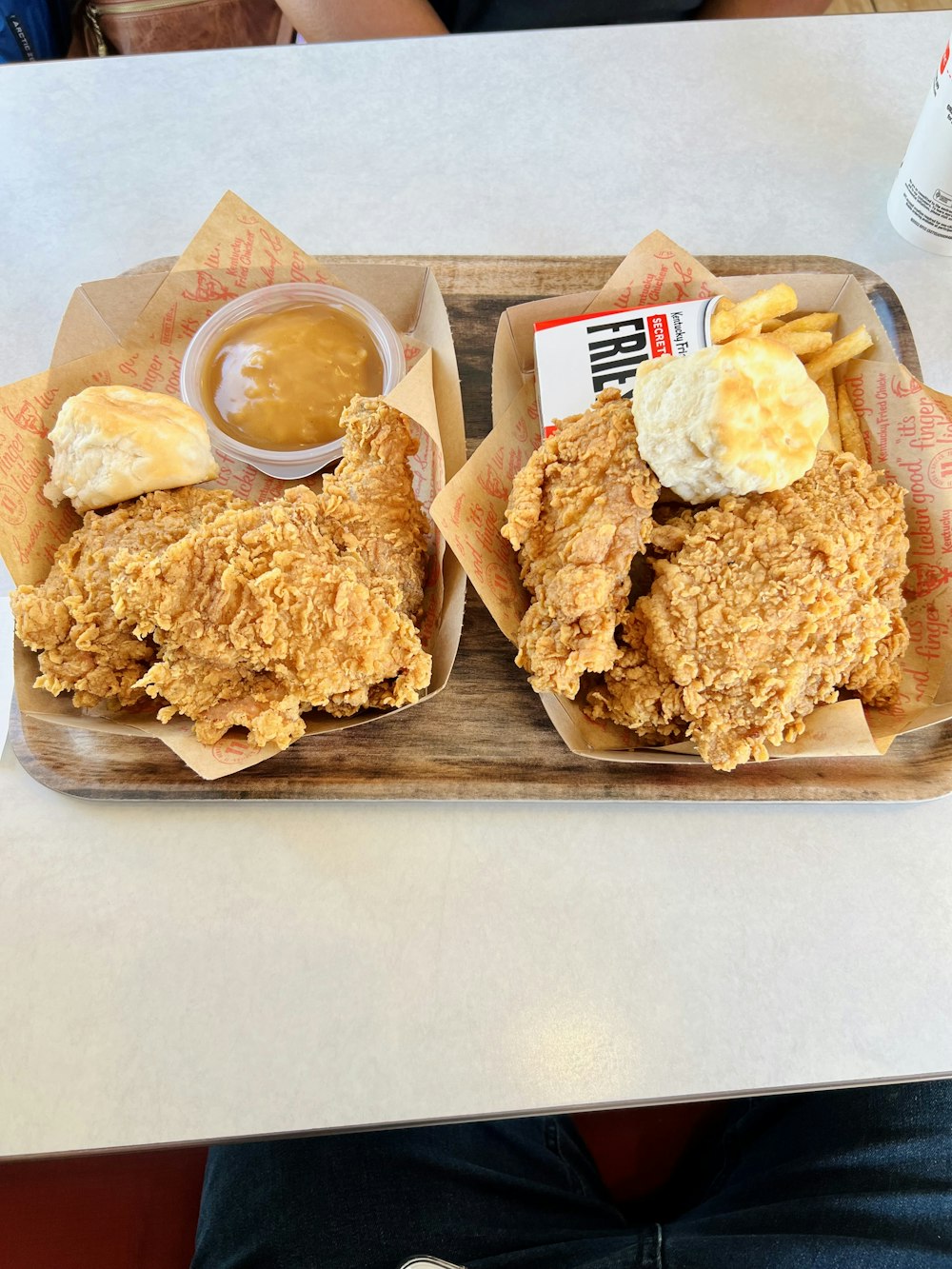 a couple of trays of food on a table