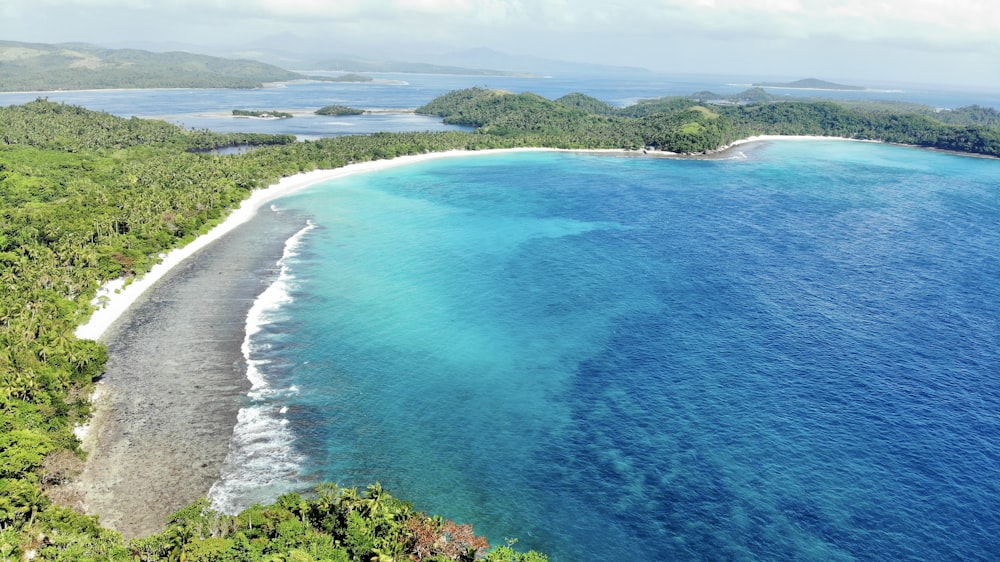 an aerial view of a tropical beach and lagoon