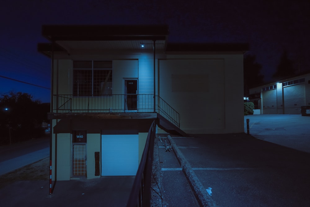 a building at night with a light on