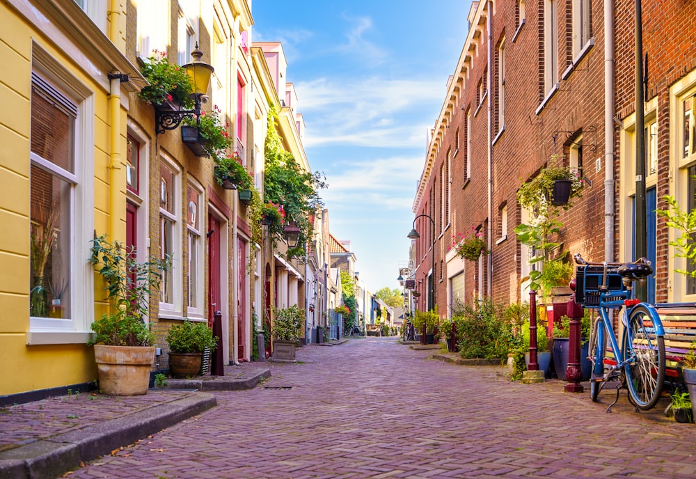 a cobblestone street lined with brick buildings