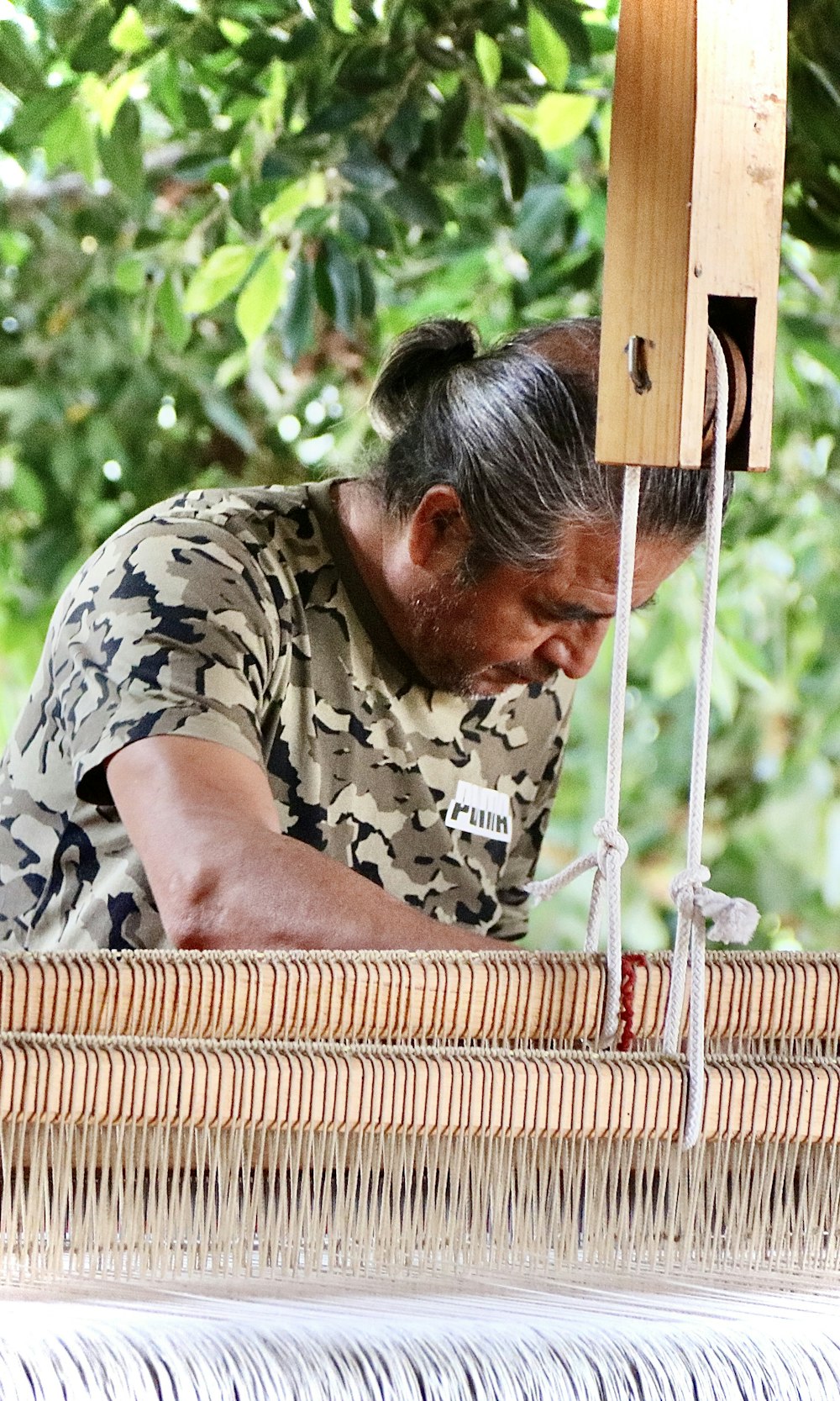 a man working on a piece of art