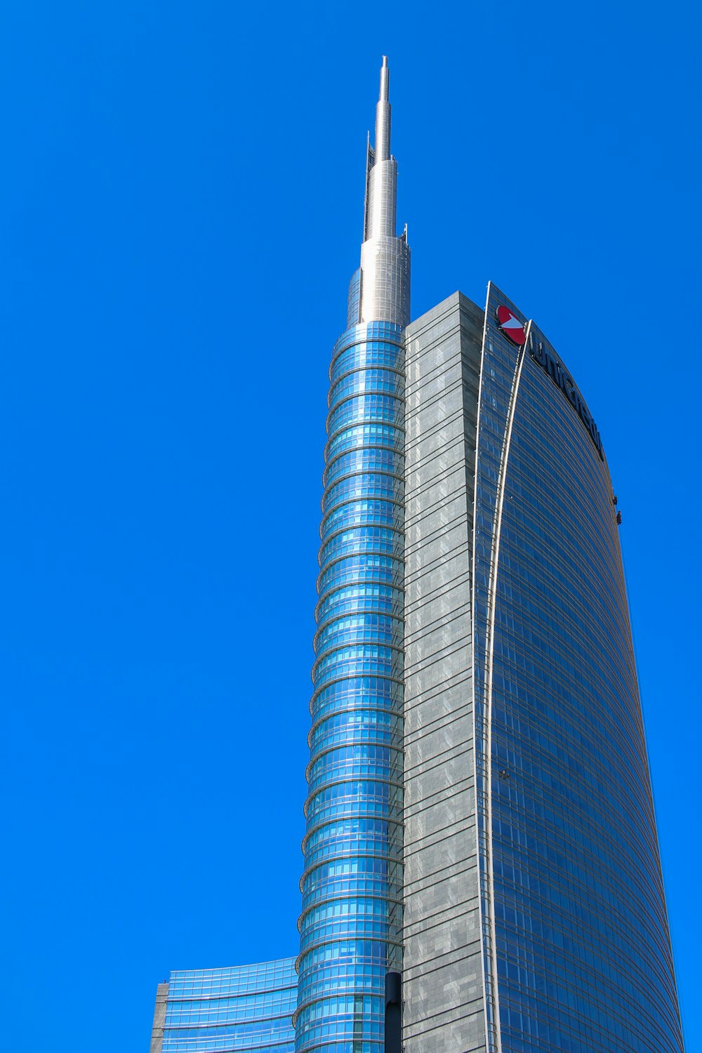 a tall building with a flag on top of it