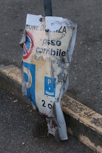 An official document showing parking regulations with a pen resting on top.