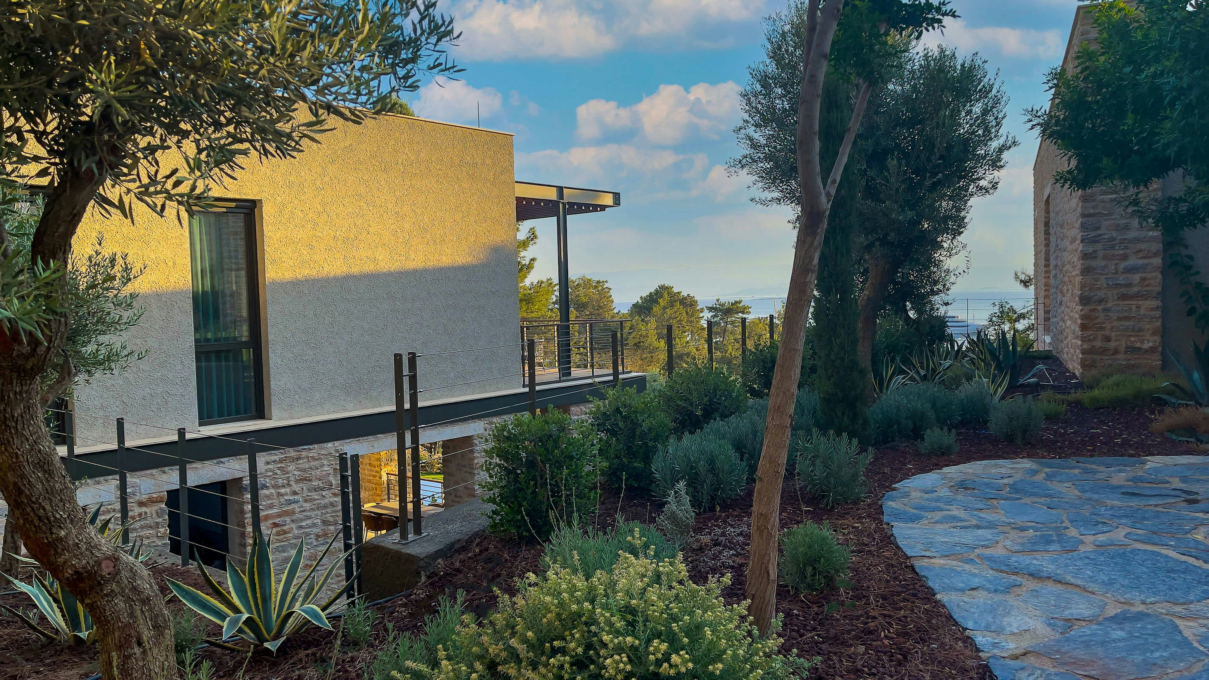 a house with a stone walkway next to it