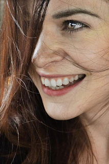 a close up of a person with a cell phone