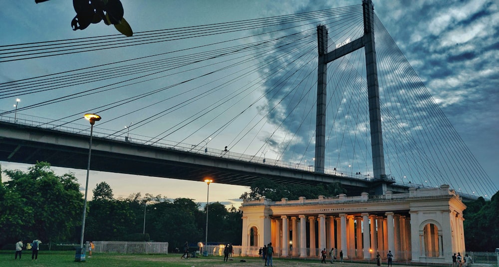 a bridge over a body of water at dusk