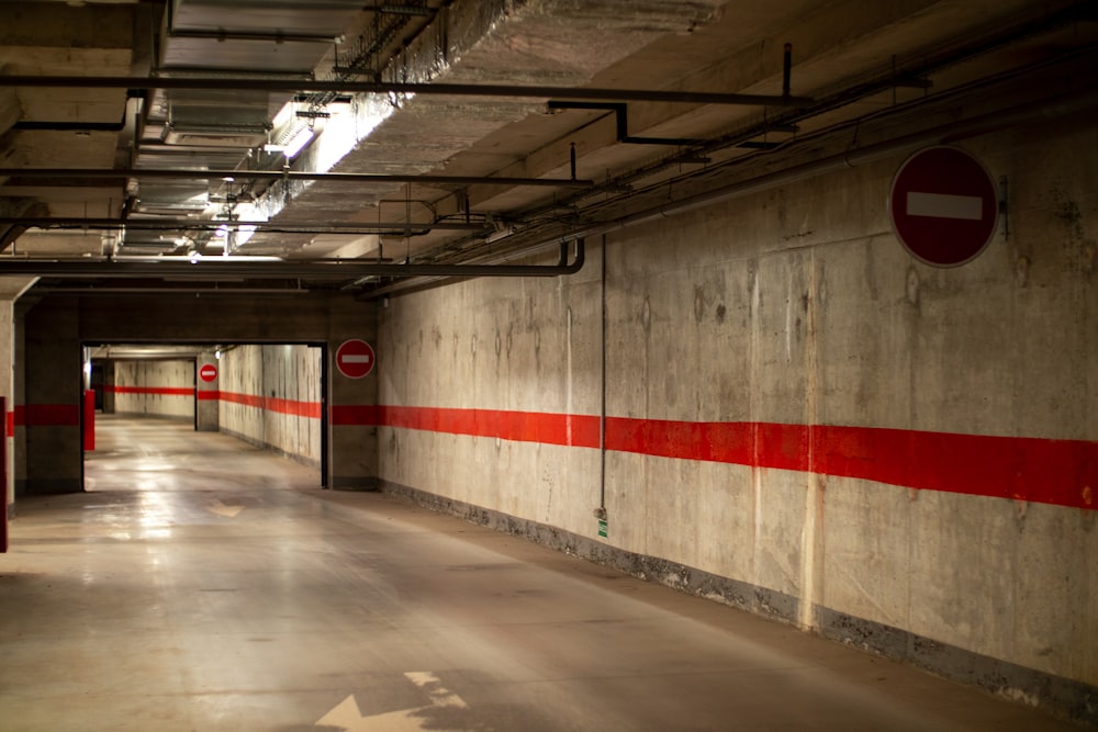 a long hallway with red and white striped walls