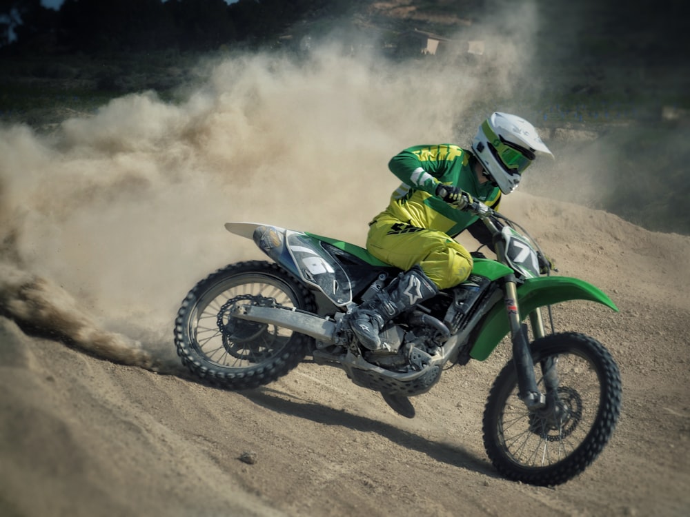 a person riding a dirt bike on a dirt road