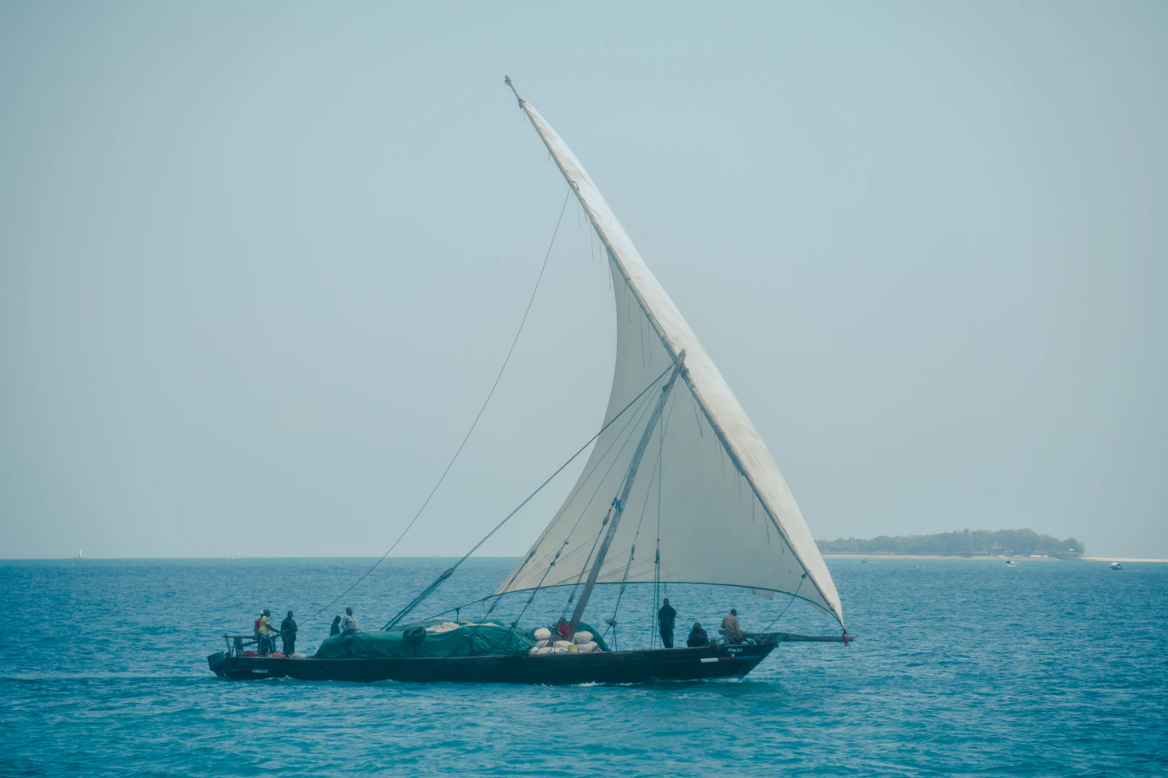 A traditional dhow sailing near Zanzibar Port