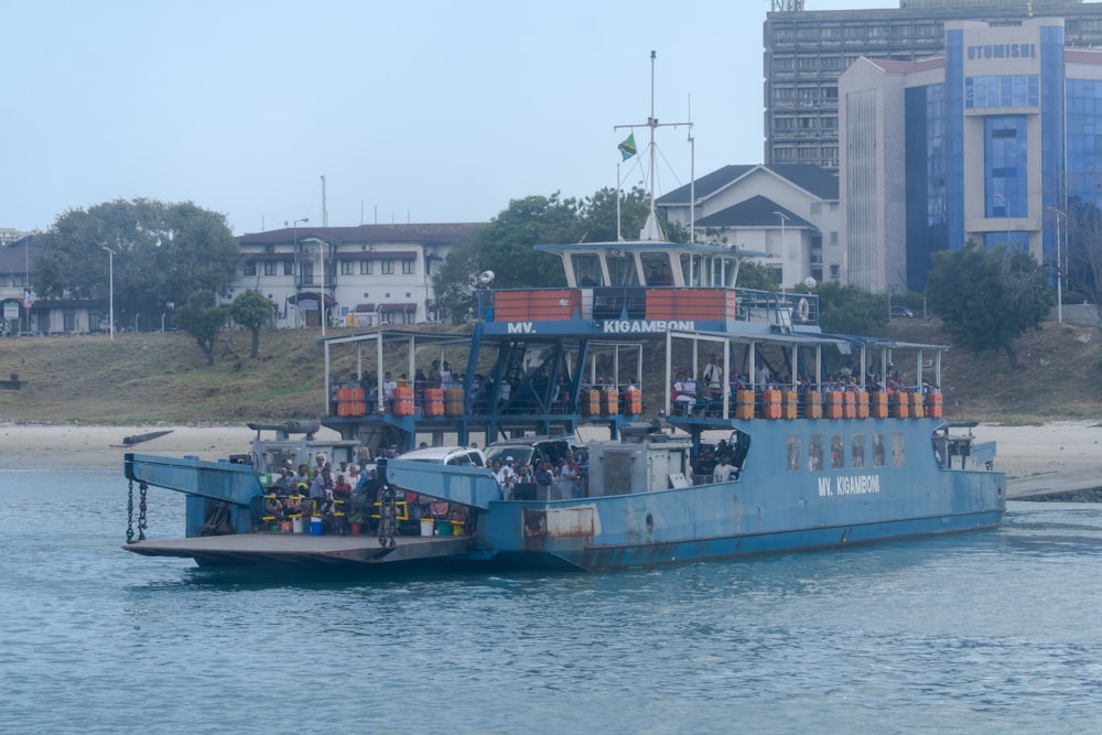 a large boat filled with people on a body of water