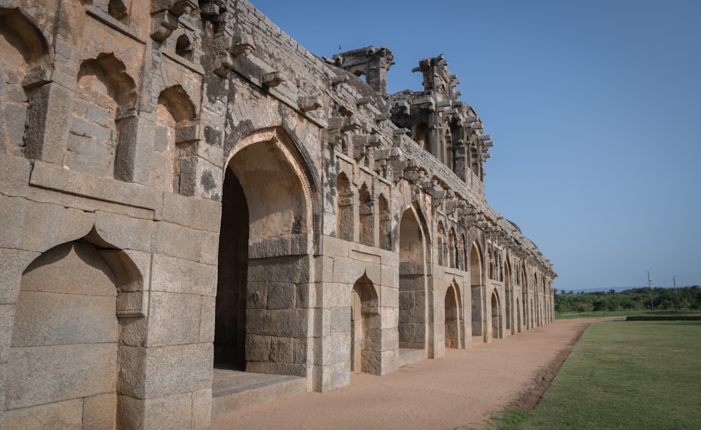 a large stone building with arched doorways