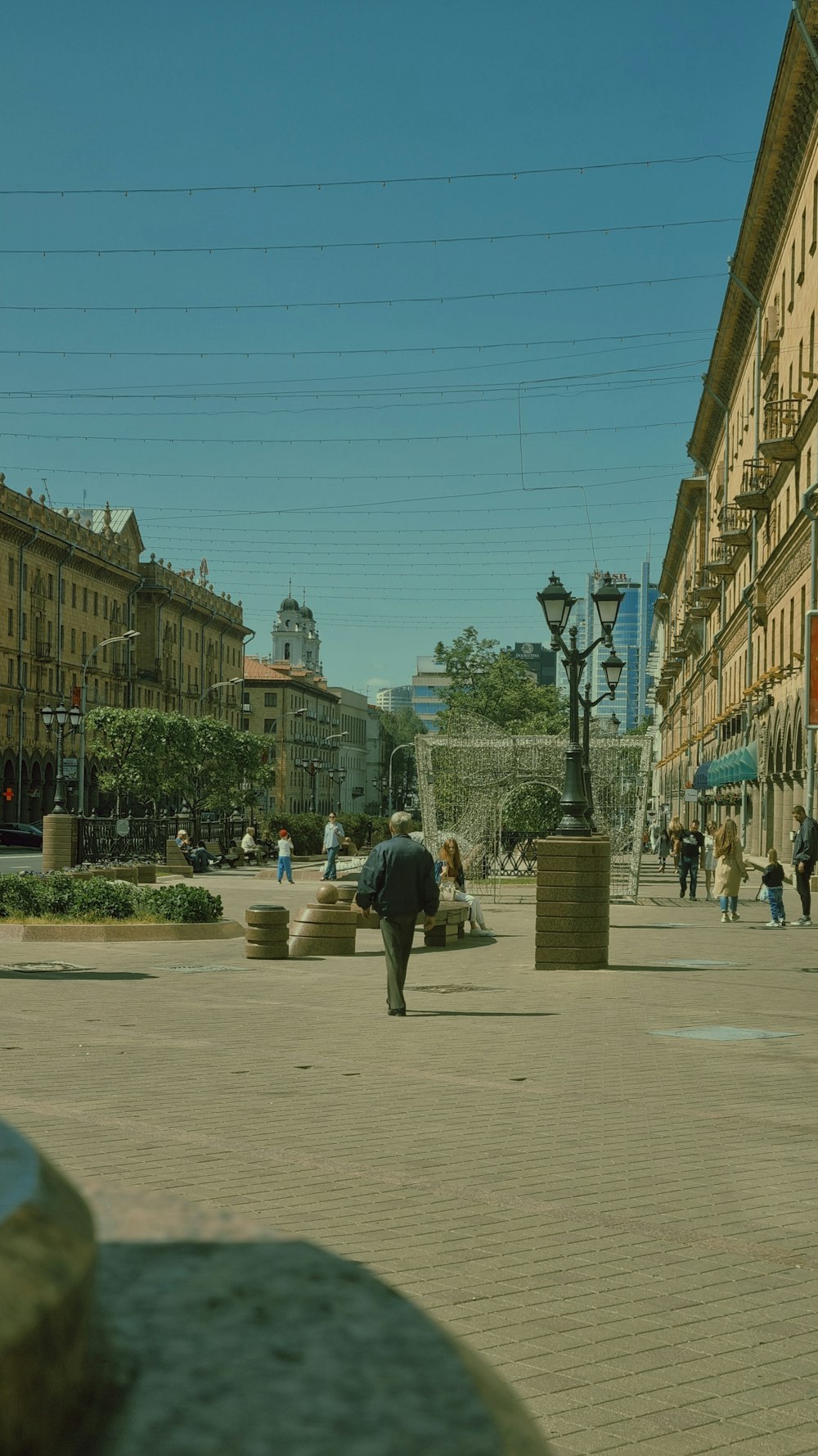 an elephant is standing in the middle of a city square