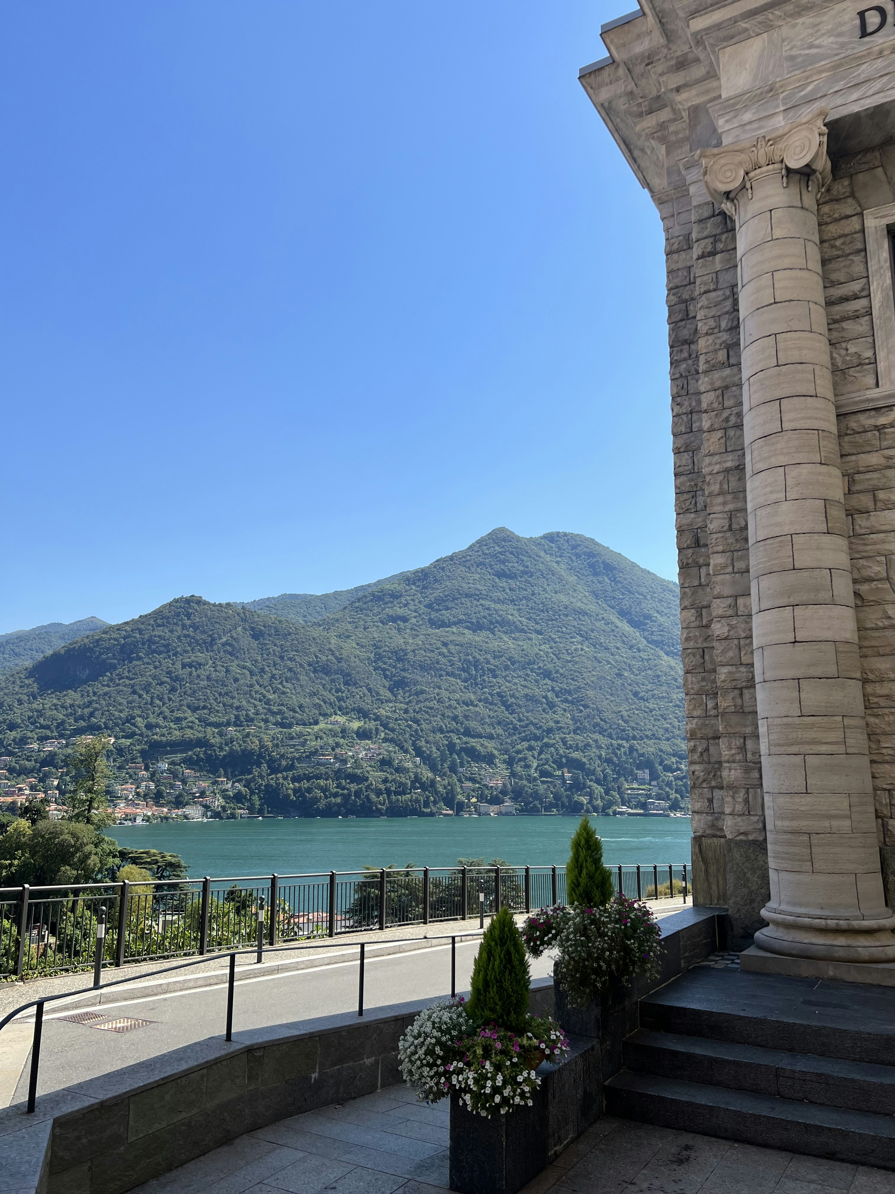 a view of a lake and mountains from a building