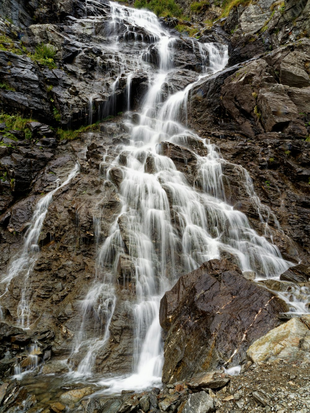 a large waterfall with lots of water coming out of it