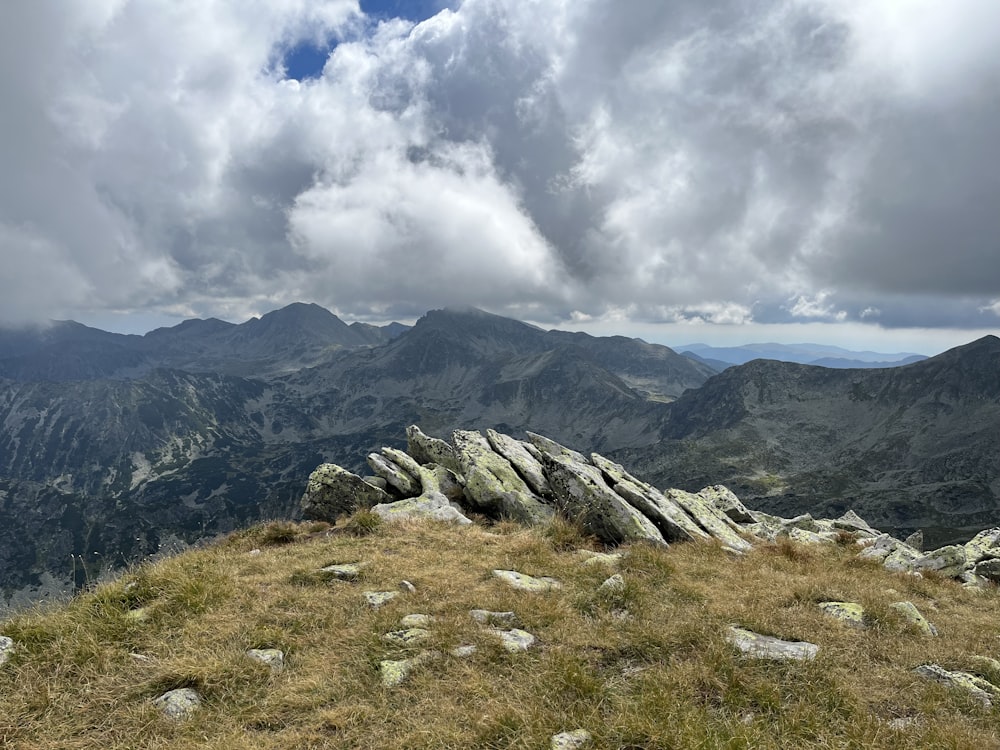 a view of a mountain range with a cloudy sky