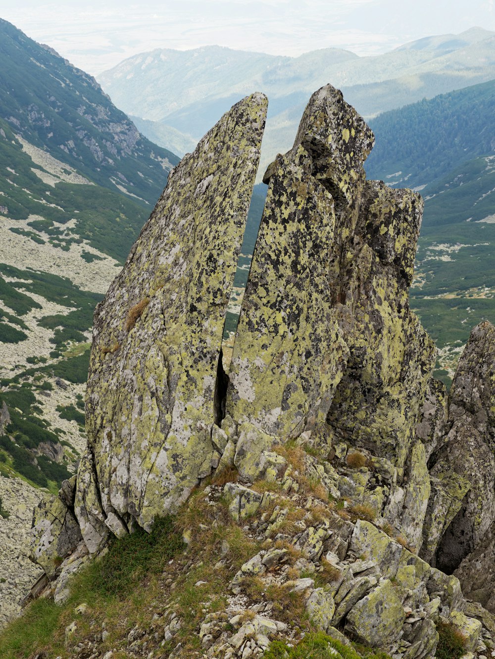 a large rock formation on top of a mountain