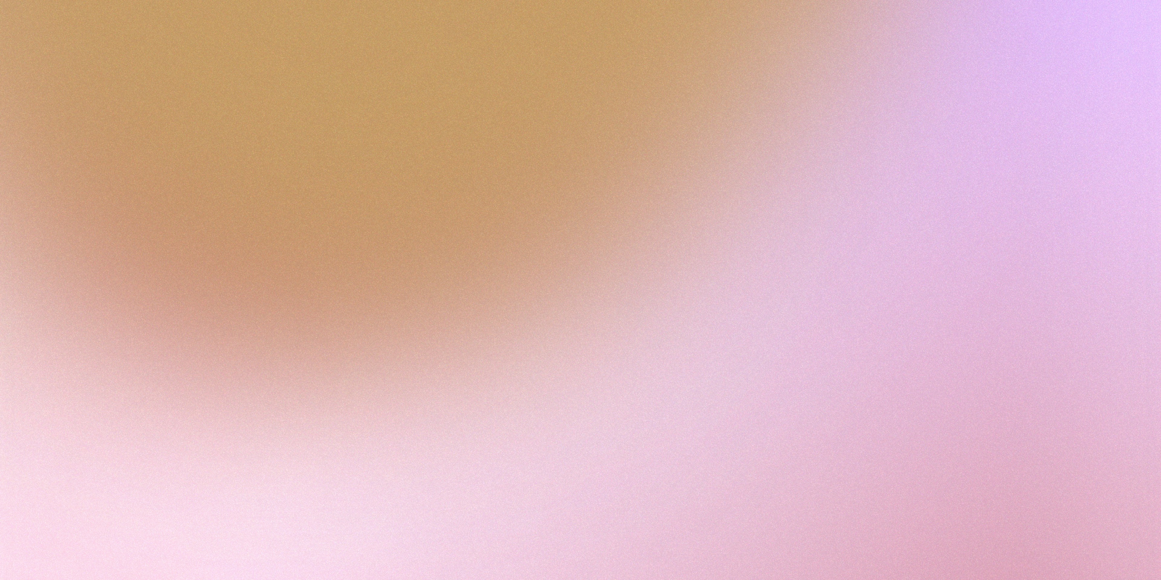 a blurry image of an orange and pink background