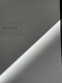 A minimalist storyboard sketch pinned on a wall, illuminated by soft natural light.