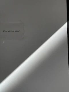 A minimalist storyboard sketch pinned on a wall, illuminated by soft natural light.