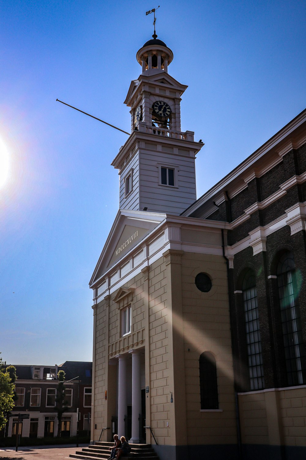 a church with a clock tower on top of it