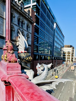 A vibrant street scene featuring a modern cityscape with mythical figures subtly integrated into the environment.