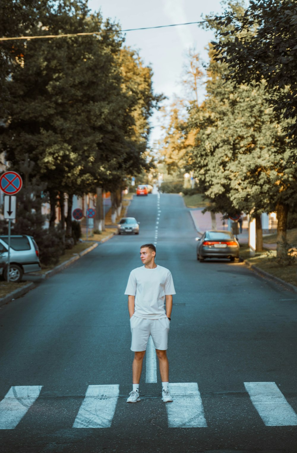 a man standing in the middle of a street