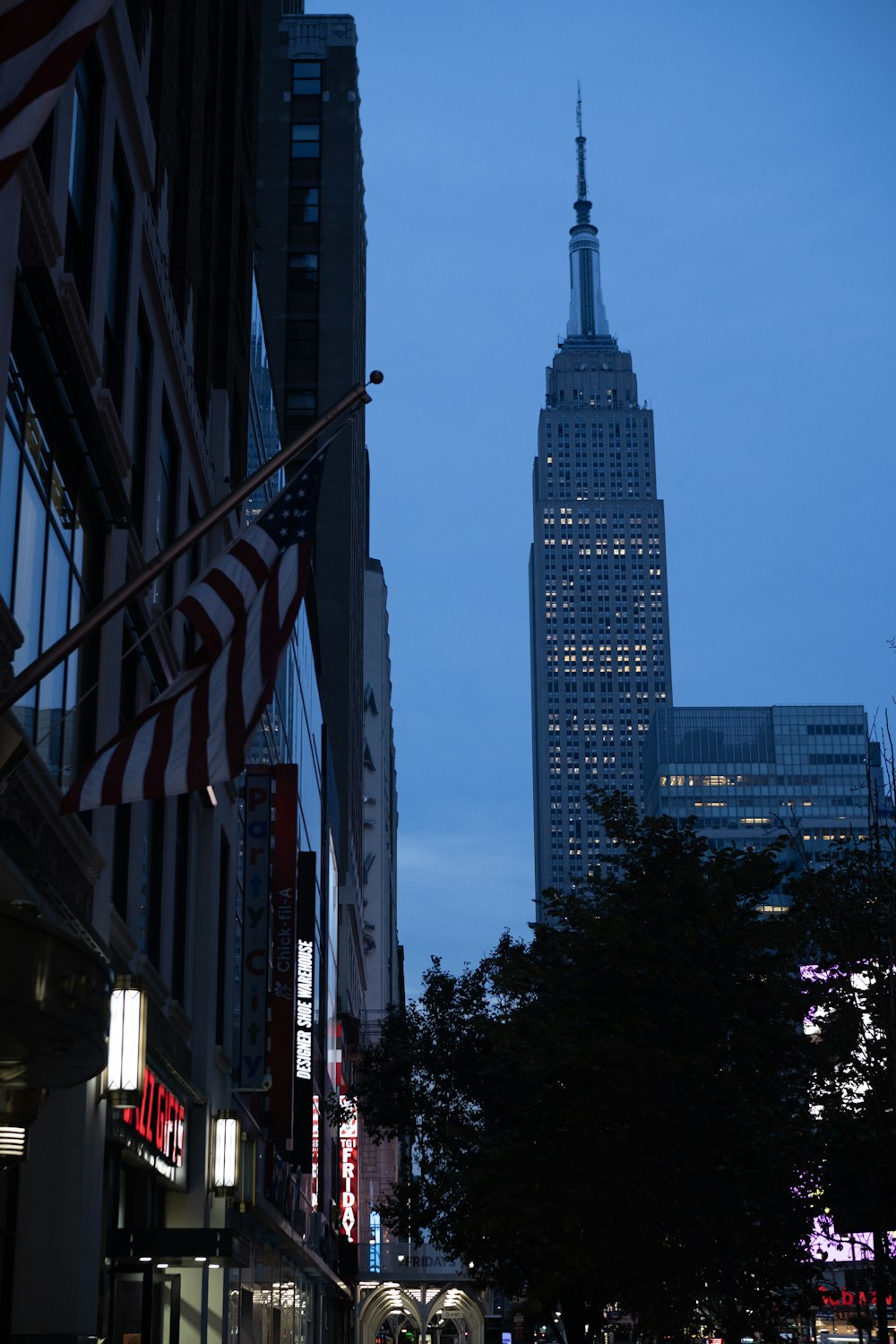 a city street with a tall building in the background