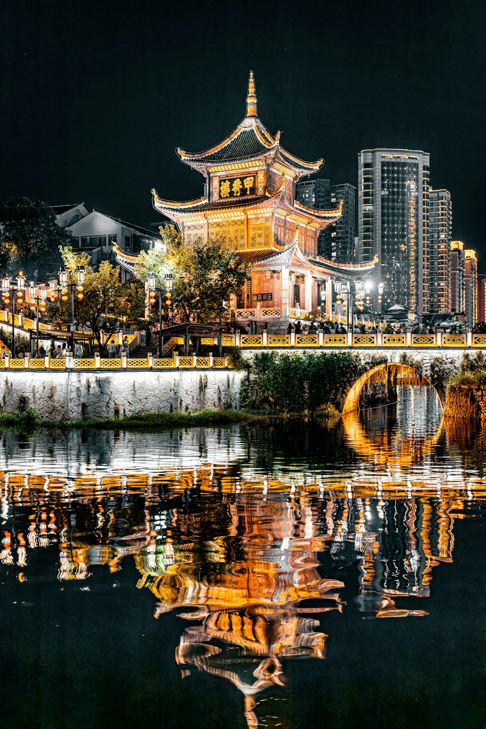 a large building sitting on top of a body of water