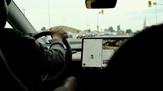Close-up of a car dashboard with a driver confidently navigating city streets.