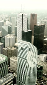 an aerial view of a city with tall buildings