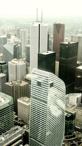 an aerial view of a city with tall buildings