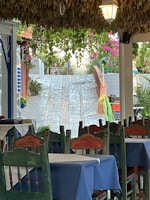 A charming outdoor dining area at a local pousada, bathed in warm afternoon light.