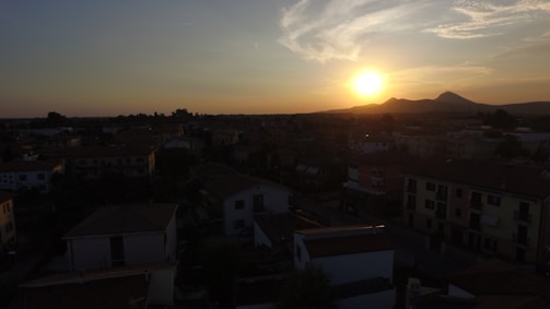 Sunset over a small town, highlighting everyday life and warmth.