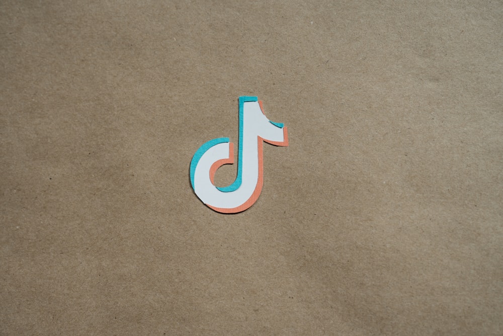 a close up of a paper cut out of the letter j