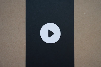 Student thumbnail gallery with progress circles on each video thumbnail under the deep black dashboard theme.
