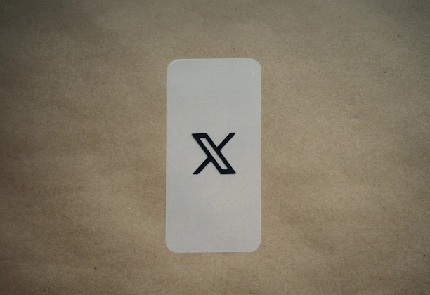 A sleek dark-themed card layout featuring rounded corners and bright yellow buttons.