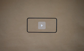 A video player interface with a sleek black background highlighting company presentation.
