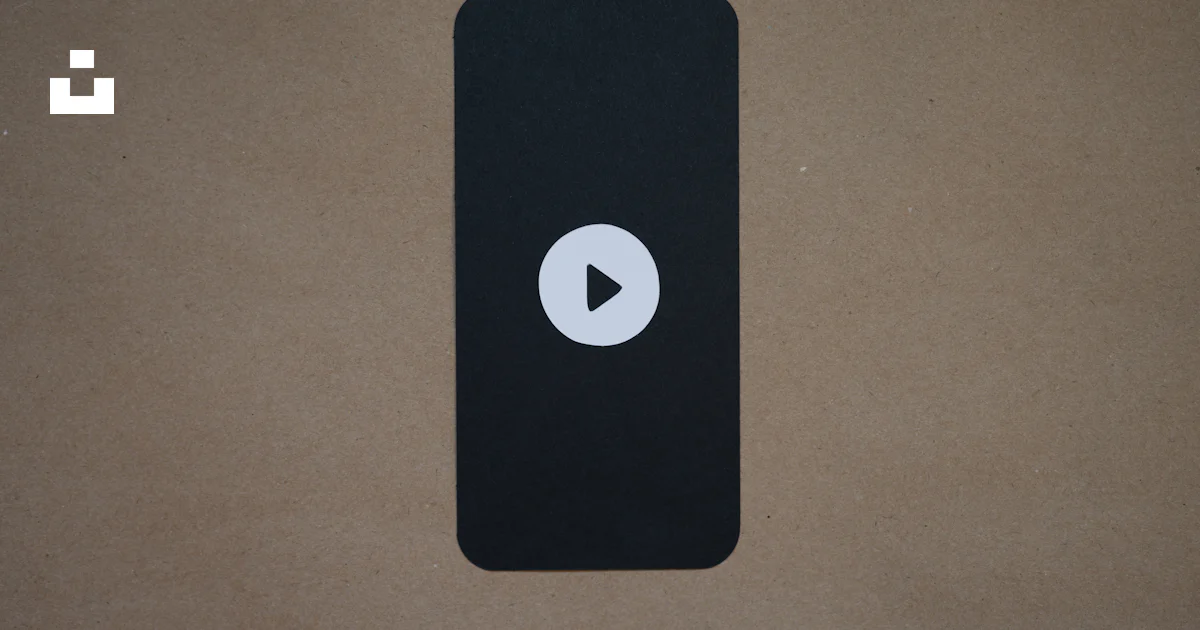 A black device with a play button on it photo – Free Symbol Image on ...
