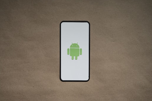 a cell phone with a green icon on it