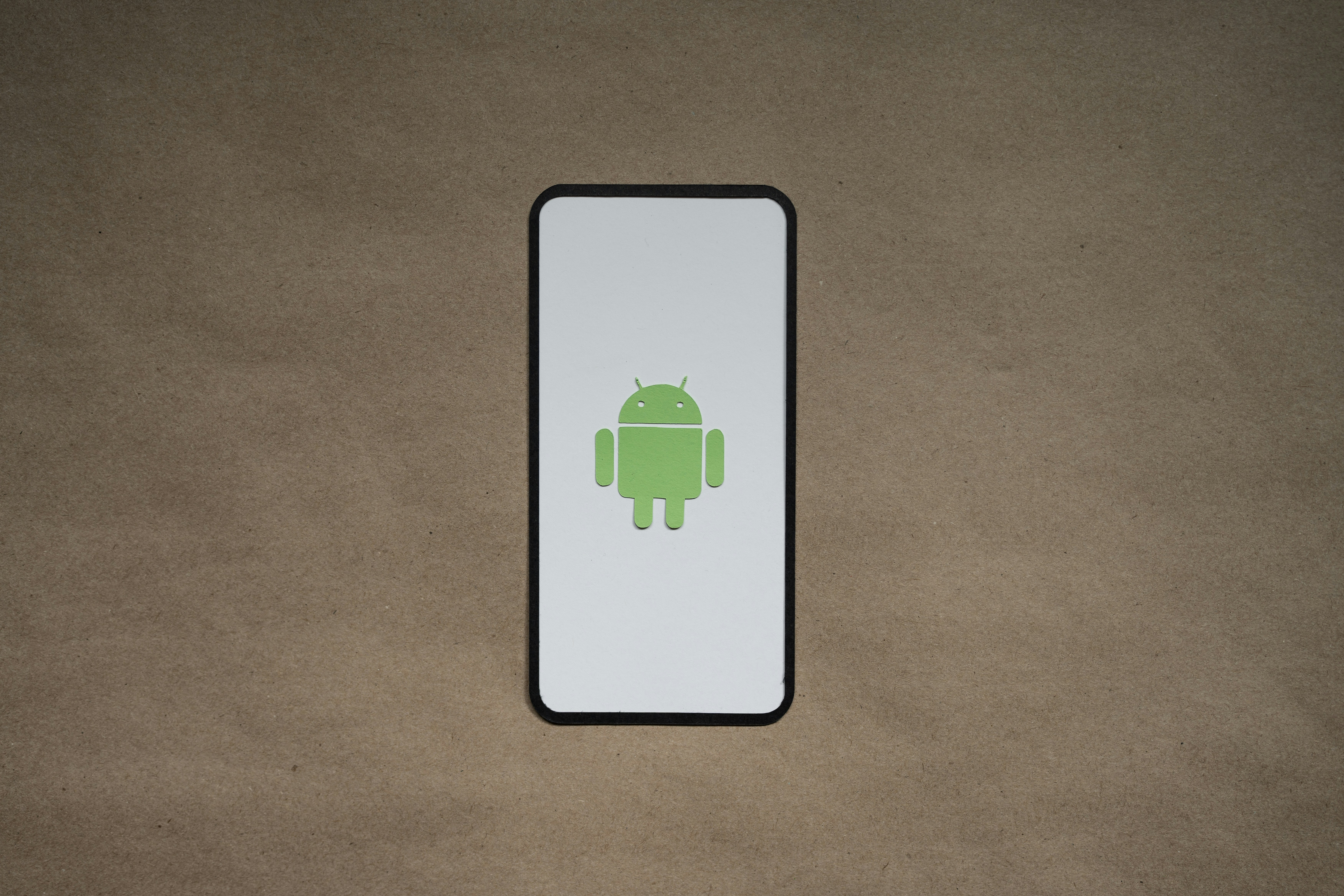 a cell phone with a green icon on it
