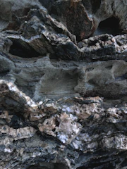 Close-up of rugged limestone rocks freshly mined, showcasing texture and color.