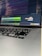 Close-up of a person typing on a laptop with a digital AI interface overlay.